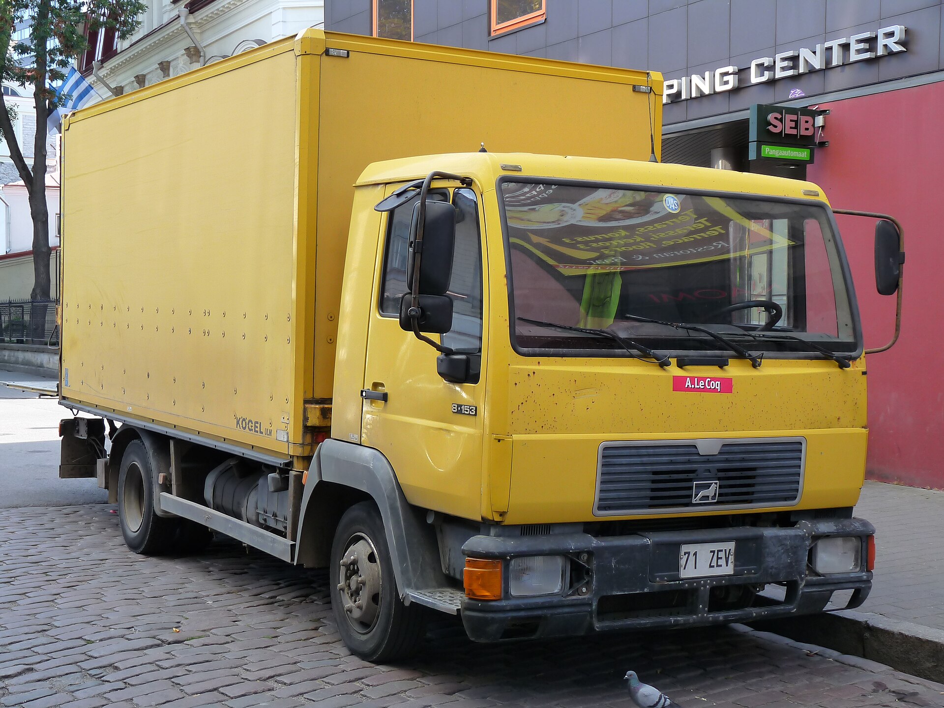 A white MAN heavy-duty truck parked on a street in Tallinn's old town