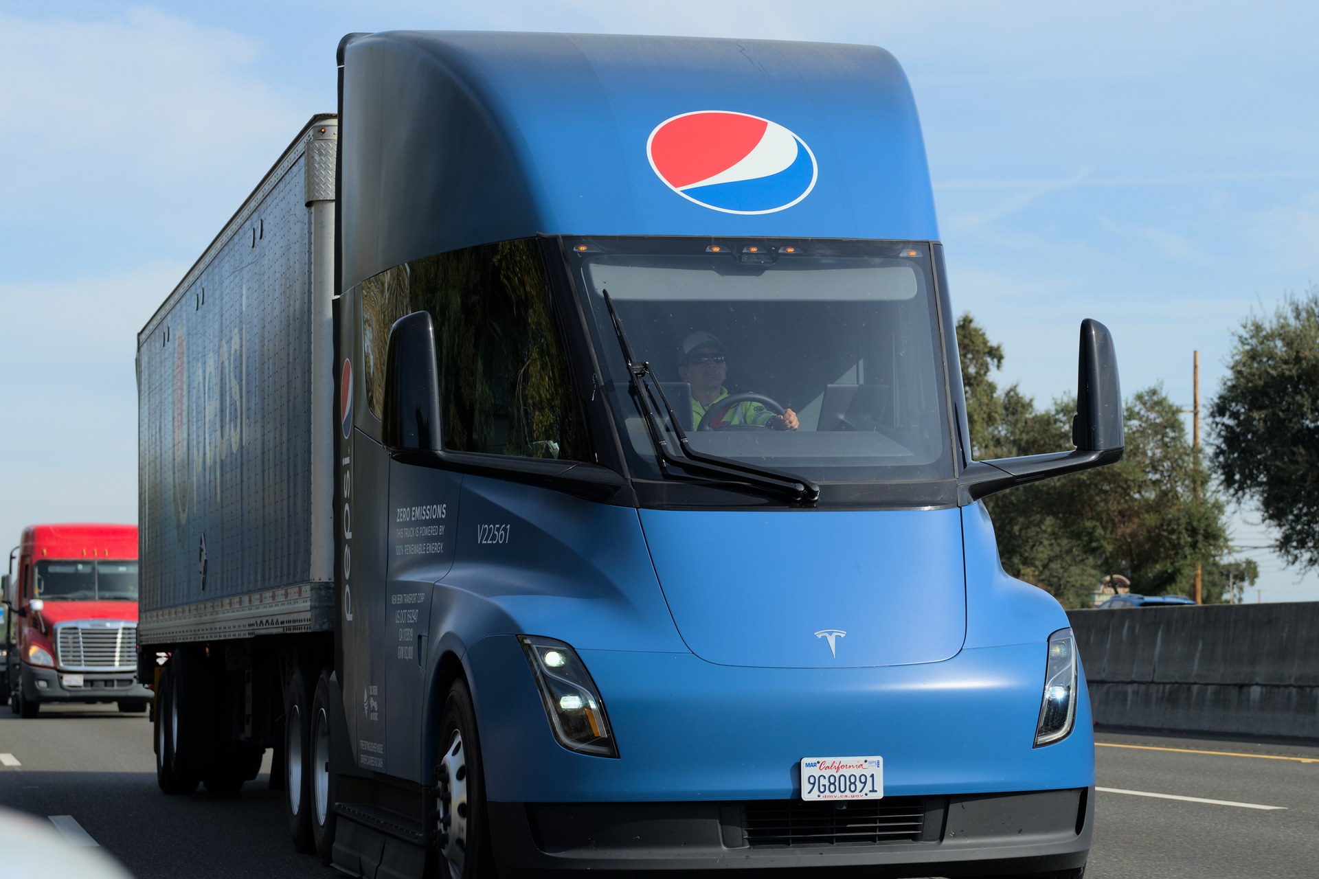 A blue Tesla Semi operated by Pepsi hauling a trailer on a road near Sacramento, California (file photo)